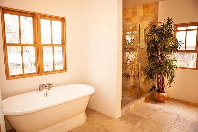 Master bathroom with elegant soaking tub, heated tile floors and huge double tile shower.