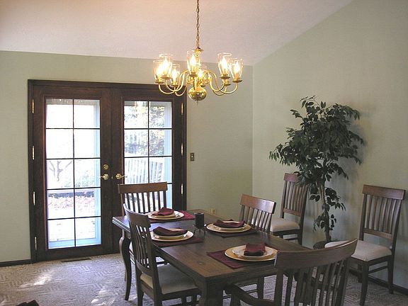 Vaulted dining area with french doors to deck