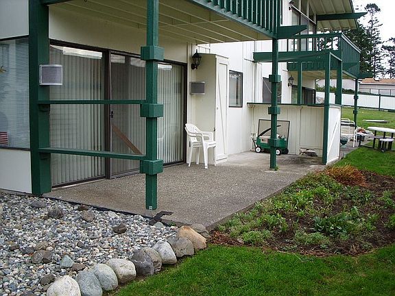Back patio with garden space. Nice and private.