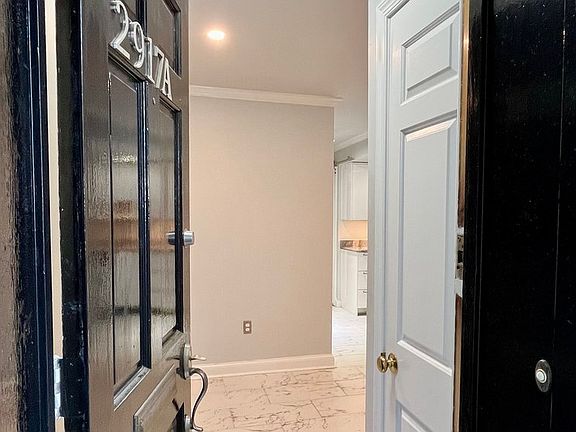 Emter the apartment. Sma;; entry hall with closet