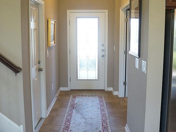 Entry way and front door.  Garage on left and Office on righ