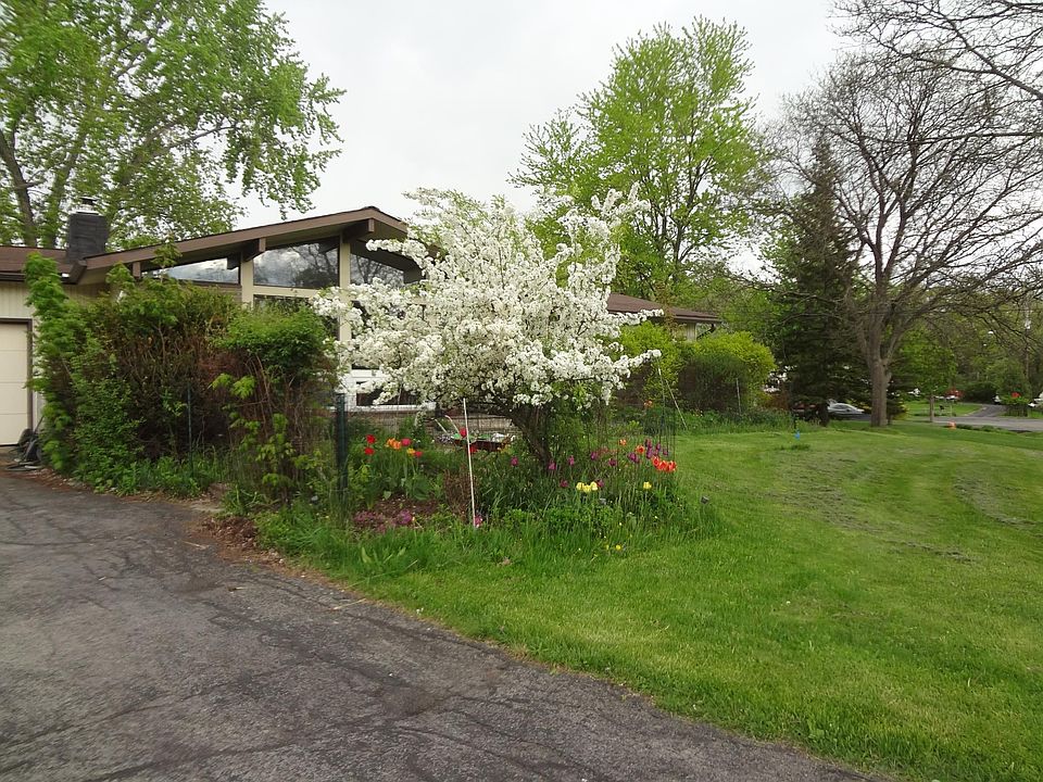 Front garden view. The apartment entrance is on the left side of the house.