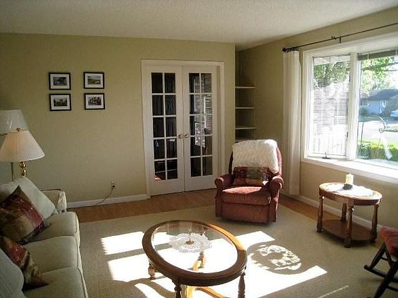 Notice the large picture window and french doors.