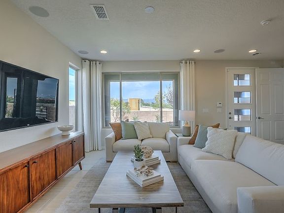 Lots of windows brighten up the gathering room of the Senita home design offered at Villas de Las So