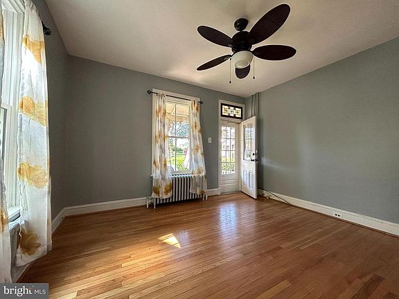 Entrance from front porch with newly painted walls and windows