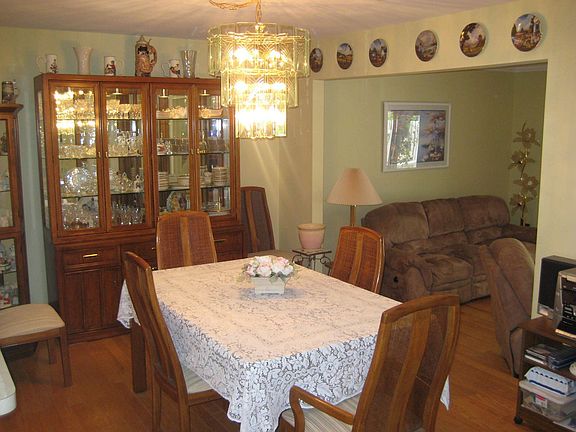 Formal dining room features hardwood floors.