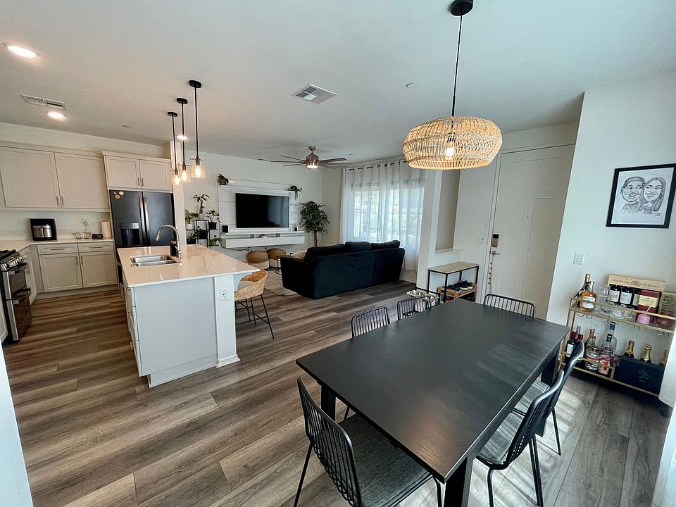 Downstairs, open concept. Dining furniture and light fixtures included