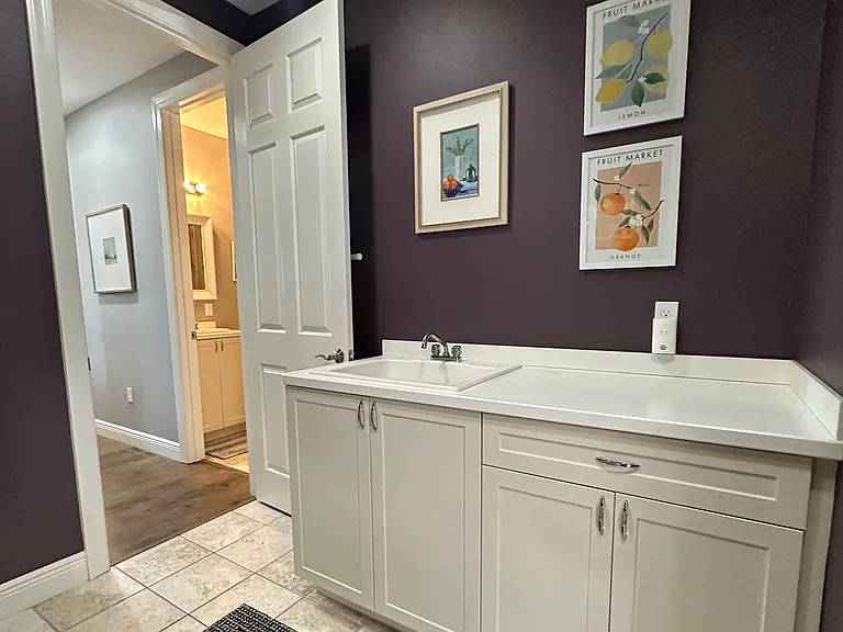 Laundry with large sink and lots of storage