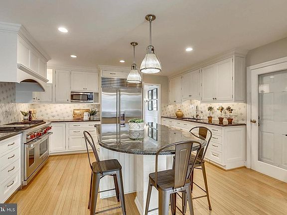 Bright and well-appointed kitchen featuring center island, w