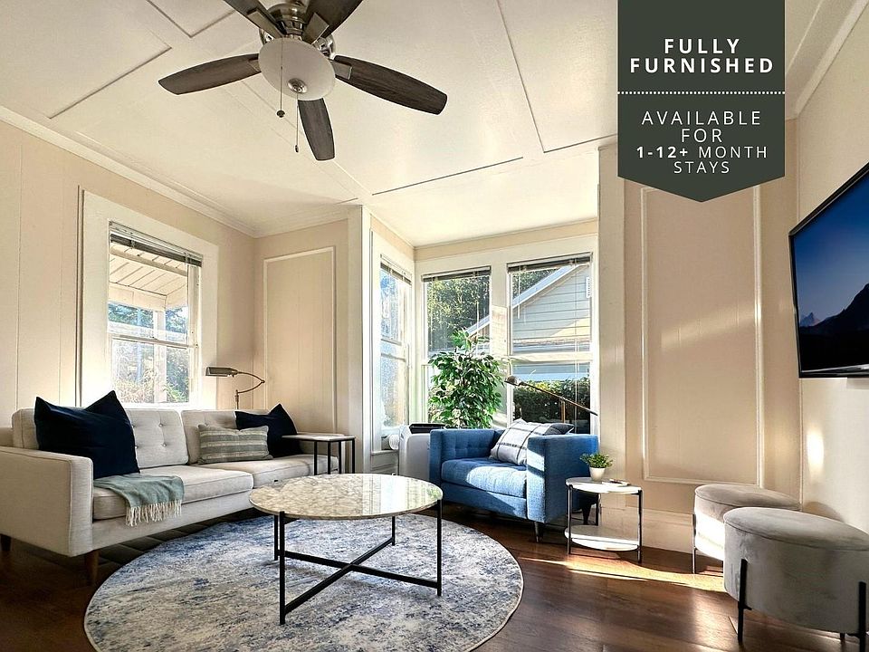 This historic home has a ton of charm! Sit down, relax and watch tv in this professionally designed living space