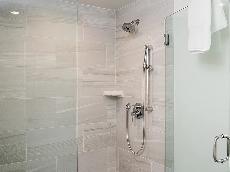 Oversized showers with floor to ceiling tile