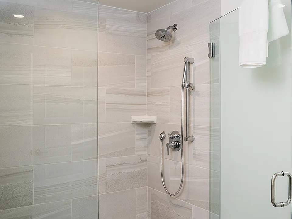 Oversized showers with floor to ceiling tile