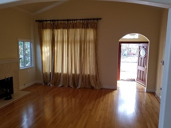 Formal entry and living room with fireplace