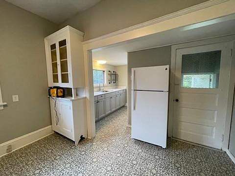 Kitchen and door to backyard and basement.