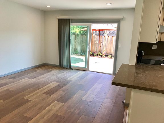 Family room adjacent to the kitchen opens to the enclosed, private patio.