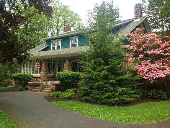 THIS HOME IS SURROUNDED BY MATURE LANDSCAPING TO ADD TO ITS PRIVACY