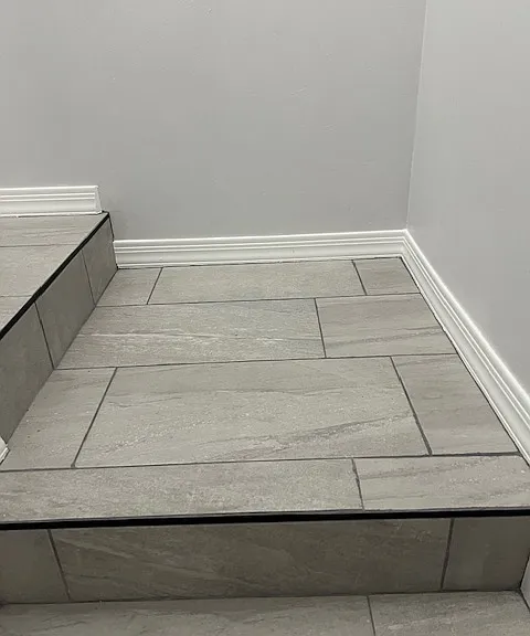 Stairwell, Brand New Tile and Grout, New Baseboard and Molding, Handrails, Chandelier Light. Freshly Painted Ceiling, Walls, Baseboards and Moldings.