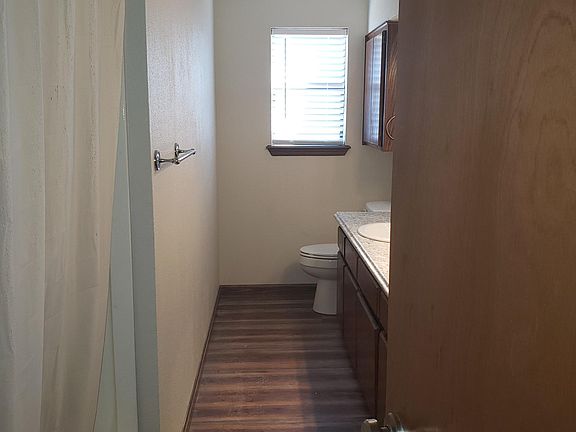 Bath with Double Sinks & plenty of Storage behind door