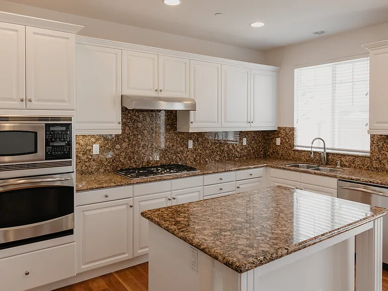 Kitchen with island and stainless steel appliances