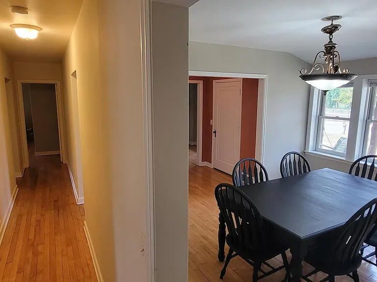 Main floor hallway. Bedroom 1 is behind me, bedroom 2 is to my left, bathroom is down the hall to the left, and master is the end of the hall.