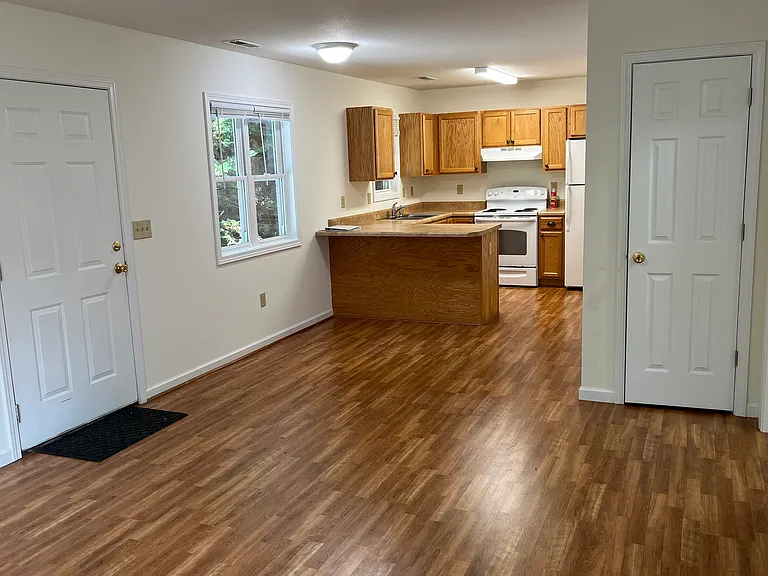Kitchen has small "eat at" counter with room for 2 tall chairs or enough room in front of counter to have small table and chairs looking out window