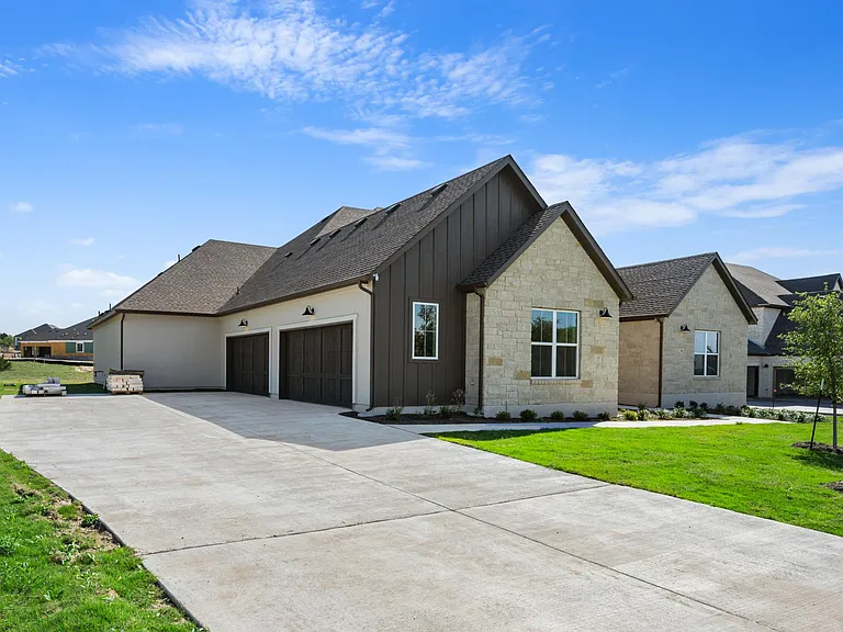 Full Four Car Garage with ample driveway