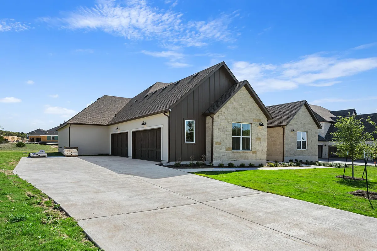 Full Four Car Garage with ample driveway - 704 Prairie Clover Dr