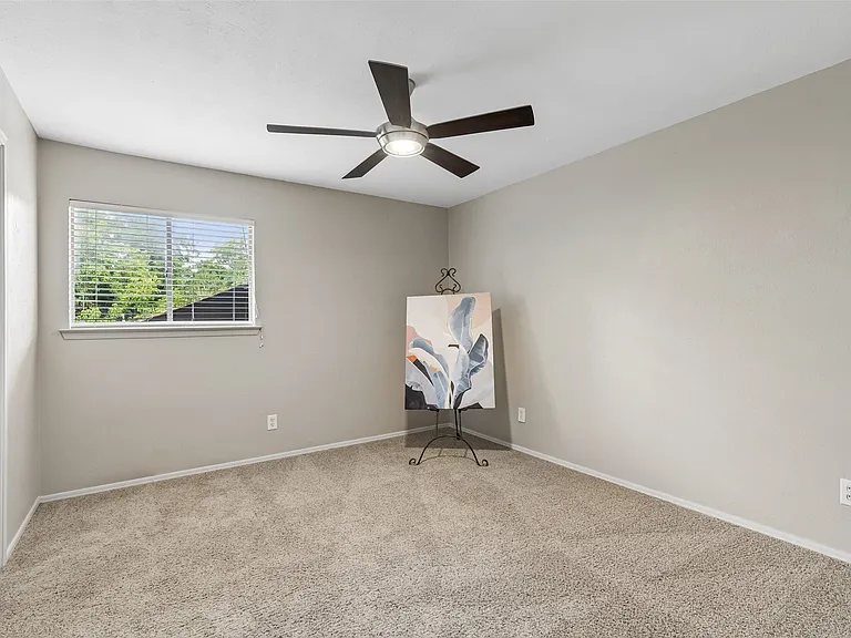 The secondary bedroom has a walk-in closet and access to the adjoining bathroom.