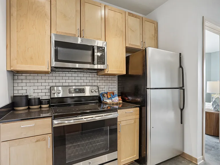 Experience culinary excellence in this sleek modern kitchen featuring state-of-the-art appliances. Experience culinary excellence in this sleek modern kitchen featuring state-of-the-art appliances.