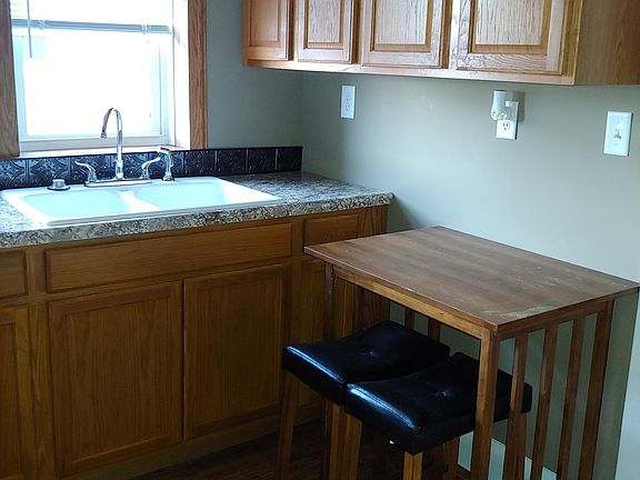 All new kitchen counter, fixtures and lower cabinets. Uppers refreshed with new trim.