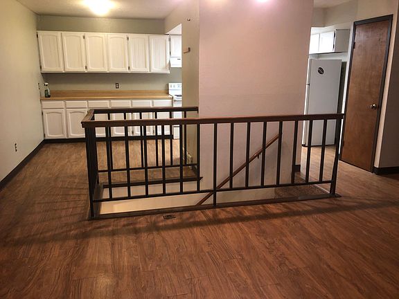 The stairs go down to the laundry room.