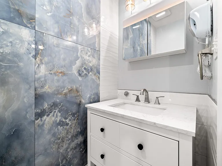 Bathroom in Master Bedroom with new tile and fixtures
