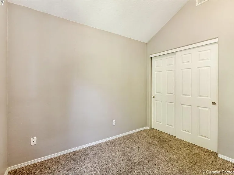 Second bedroom on upper level also has its own walk in closet .