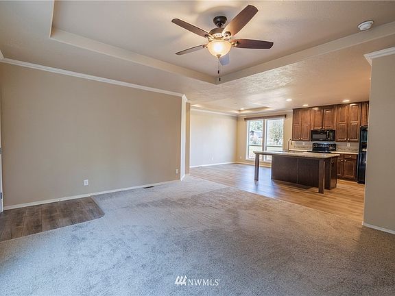 Another view of your living room showing the kitchen and dining area. 