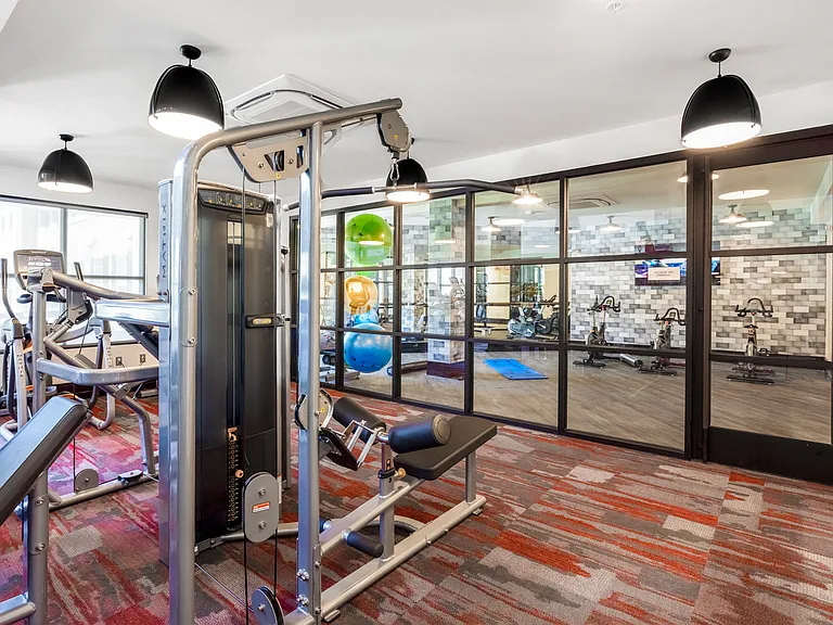 24-hour fitness center with cardio and weight-training