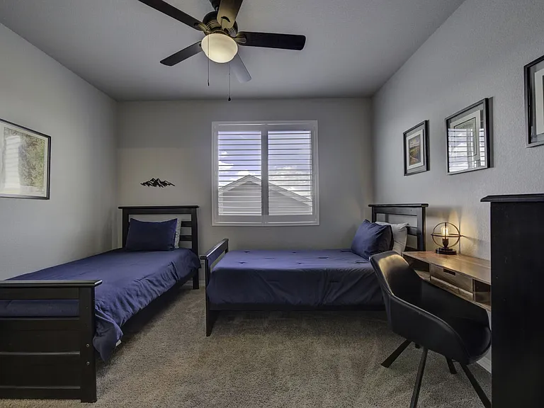 Twin Bedroom
Upstairs bedroom with two twin beds, desk, and dresser