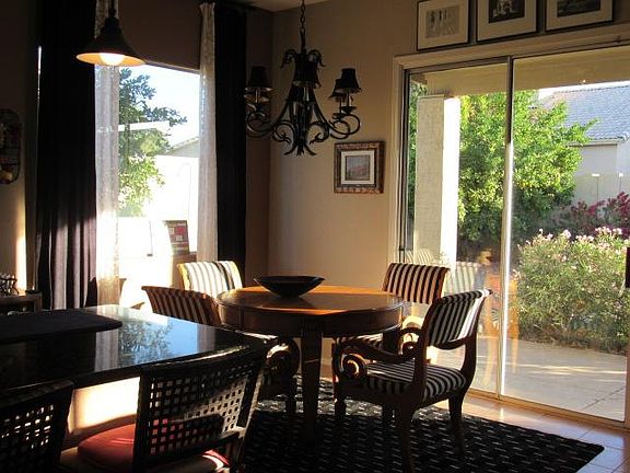 Dining in great room with full views of the backyard