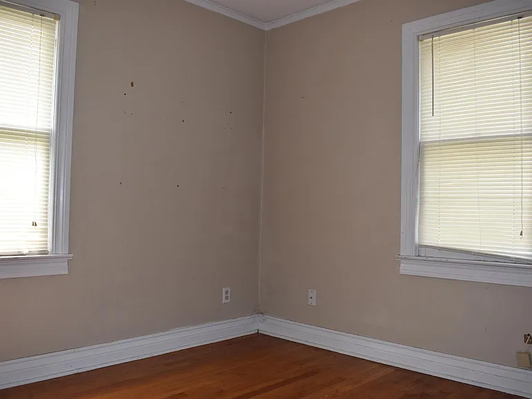 Natural Lighting with lots of windows. Original red oak wood floors!