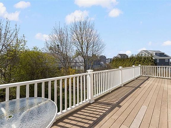 Deck overlooking backyard (Fall) Summer has crank awning for shade