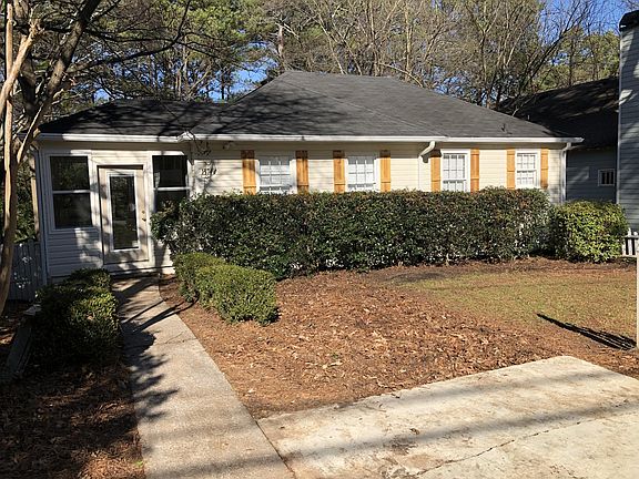 Front left view. with partial view of parking pad