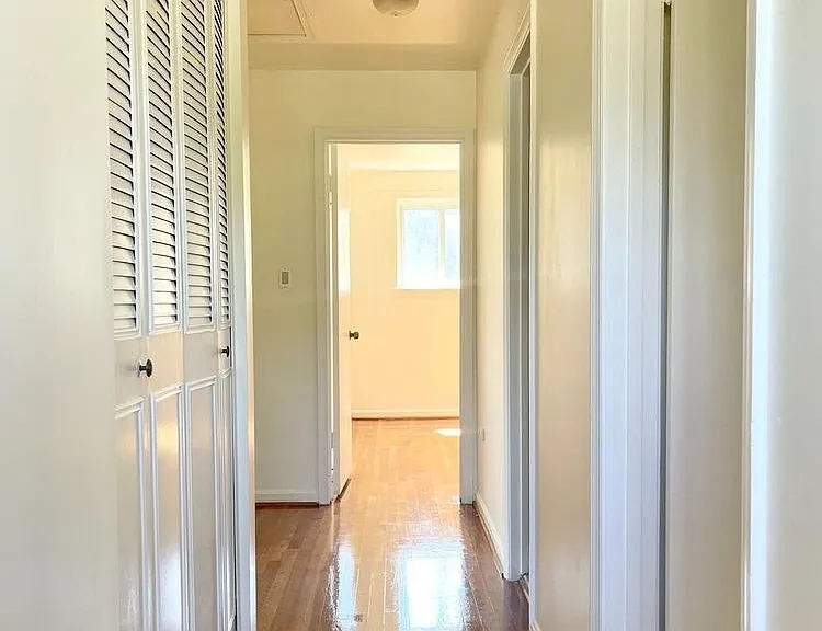 Hallway with linen closet