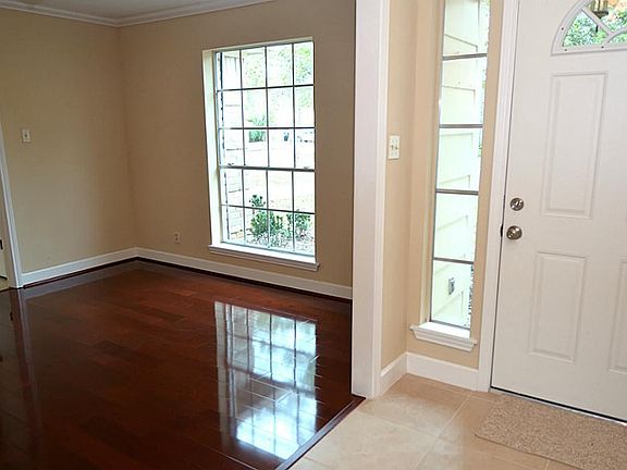 Entry to the home is beautiful tile and the formal dining room. open to the kitchen.