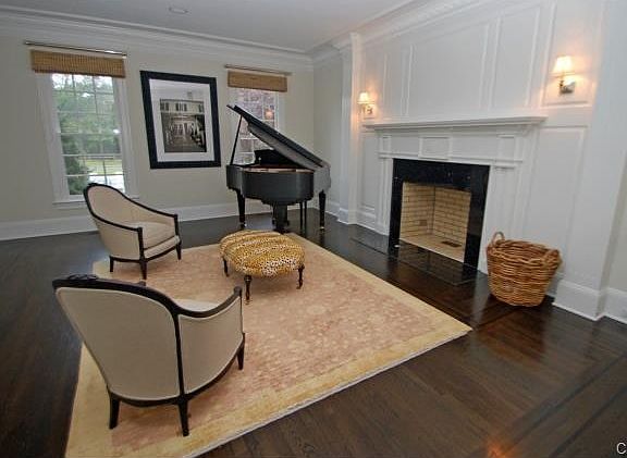 Formal living room with raised panels, rich moldings and wood fi