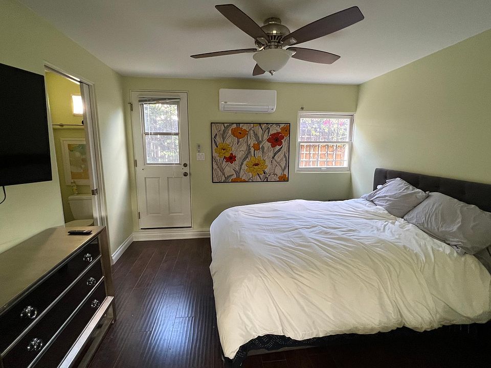 bedroom with access to back patio