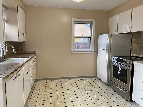 Large kitchen with full size fridge and new stove