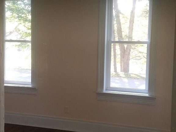 Living room with riiver views & hardwood floors