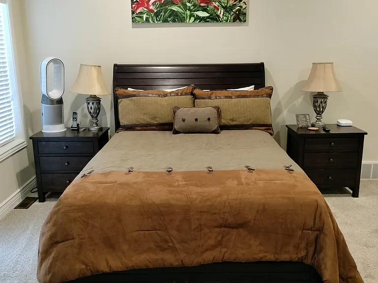 Master bedroom features a new Kingsdown queen bed, Smart TV, walk in closet, private walk-out deck with attached hot tub and pergola (to be installed before move-in). Enjoy luxury, privacy, and mountain views in this spacious retreat.