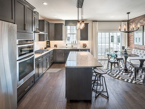 Kitchen with Large Center Island Overlooks Casual Dining Area