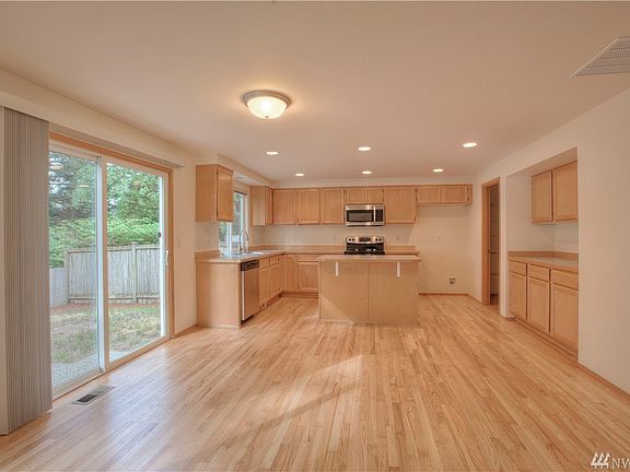 Additional counter and cupboard space between dining nook and kitchen. 