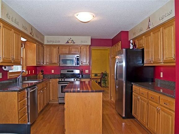 Granite countertops & black walnut island